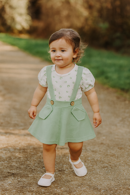 Green and white pinafore dress