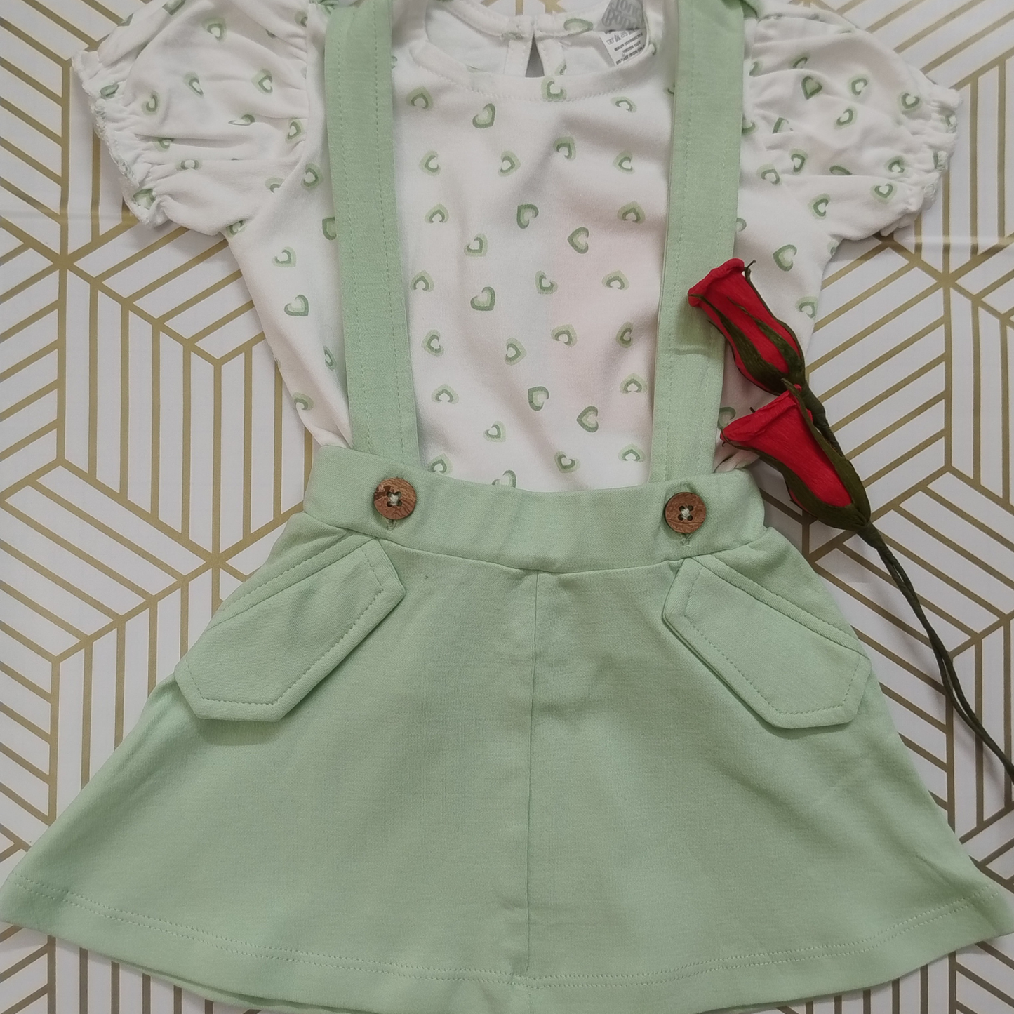 Green and white pinafore dress