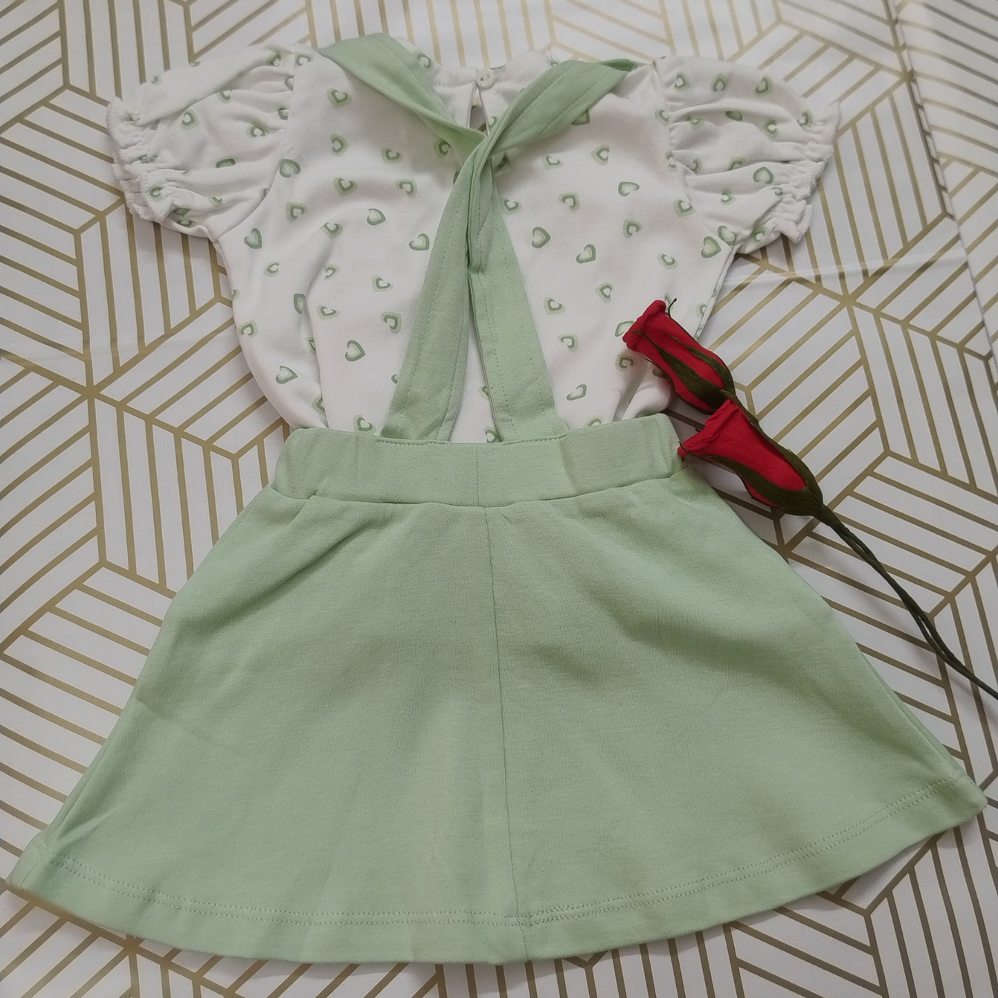 Green and white pinafore dress